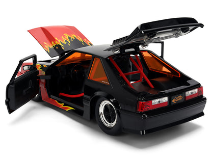 1989 Ford Mustang GT Black with Red Flame Graphics and Chester Cheetah Diecast Figure "Cheetos Flamin' Hot" "Hollywood Rides" Series 1/24 Diecast Model Car by Jada